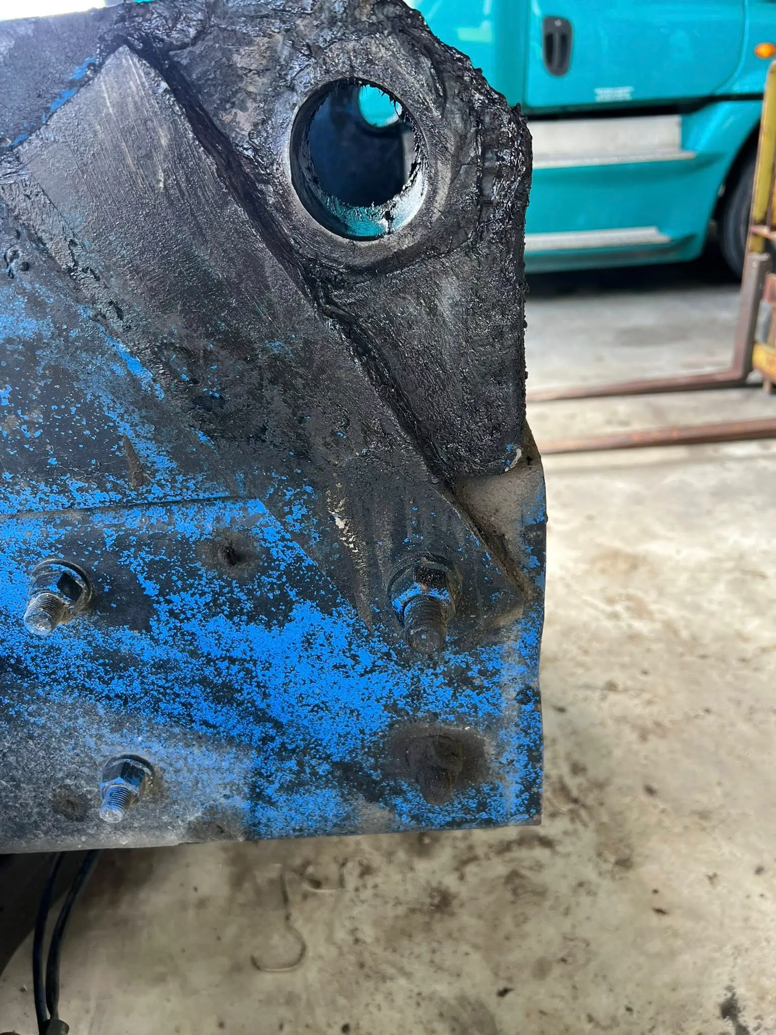 Equipment frame pivot rebuilt — old bushing bore restored